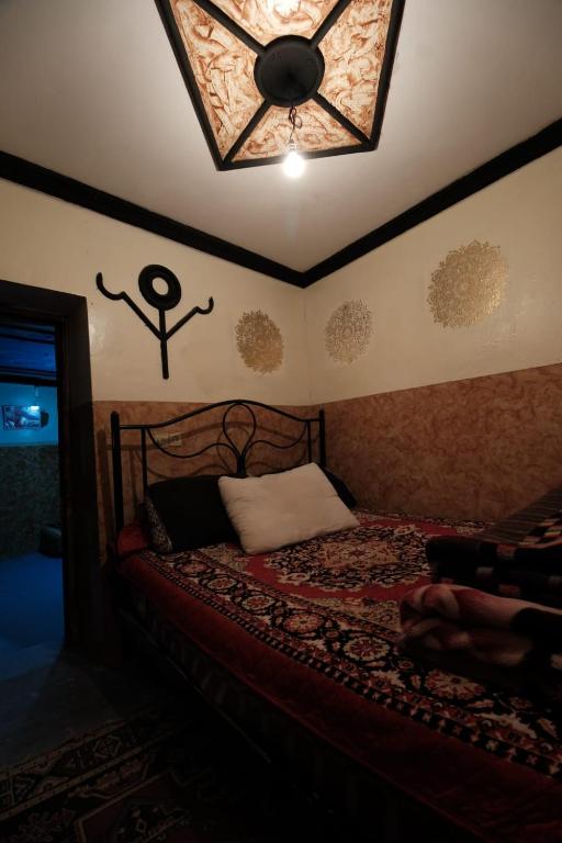 Postel nebo postele na pokoji v ubytování Gite Timit la maison Imazghn