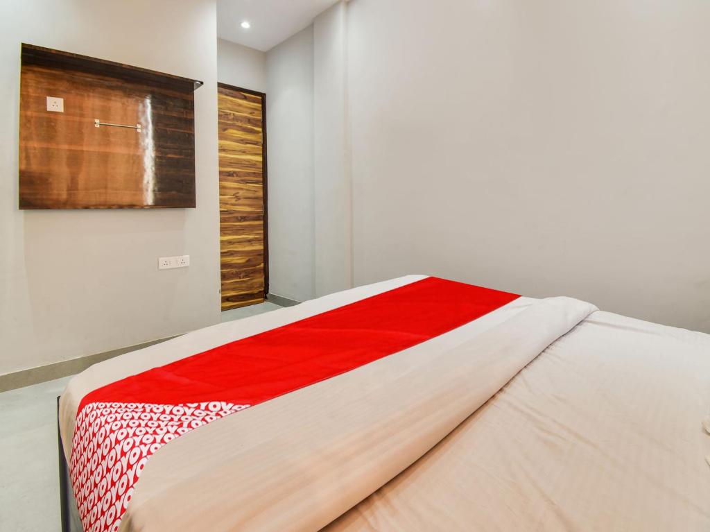 Postel nebo postele na pokoji v ubytování Hotel O Iris Lite