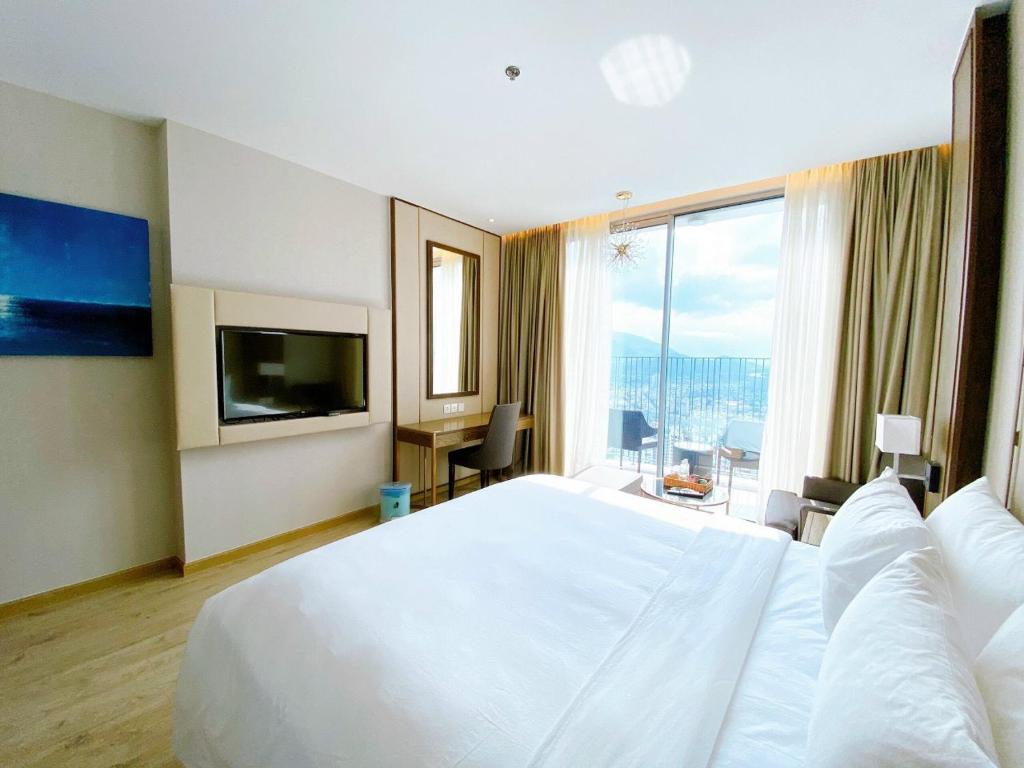 Postel nebo postele na pokoji v ubytování Panorama Beach Pearl Nha Trang Residences