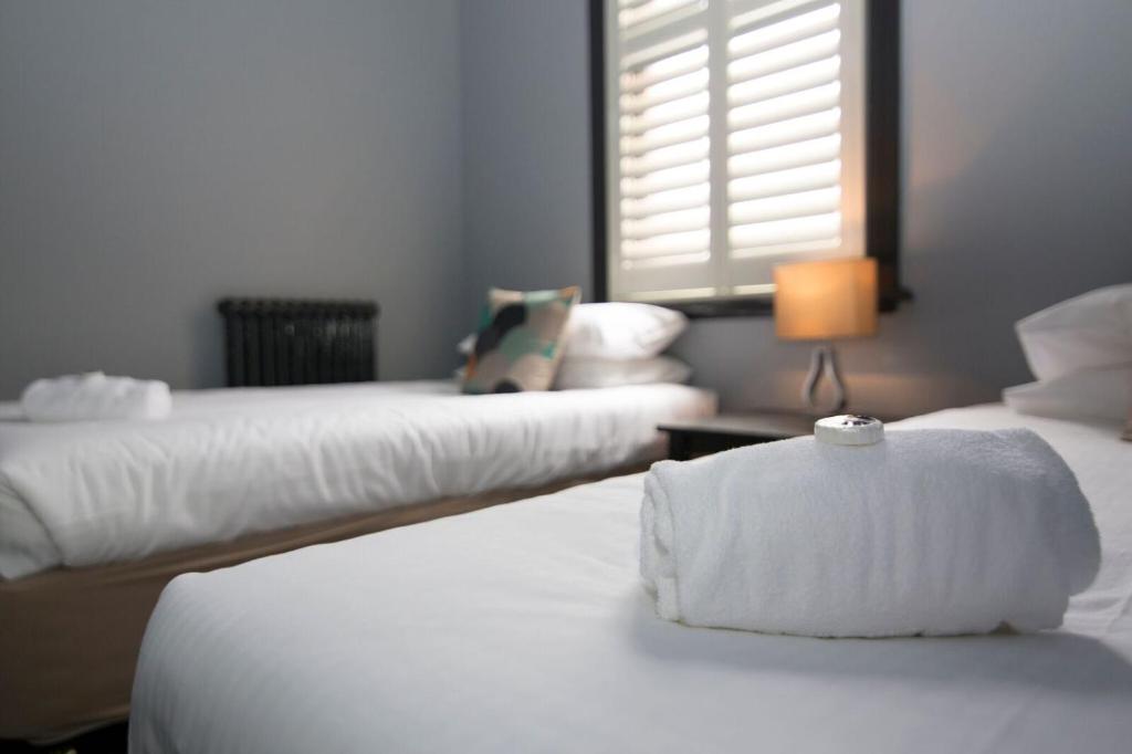 Postel nebo postele na pokoji v ubytování Hotel Canobolas