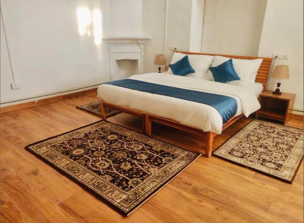 Postel nebo postele na pokoji v ubytování Nishantam Boho Mussoorie