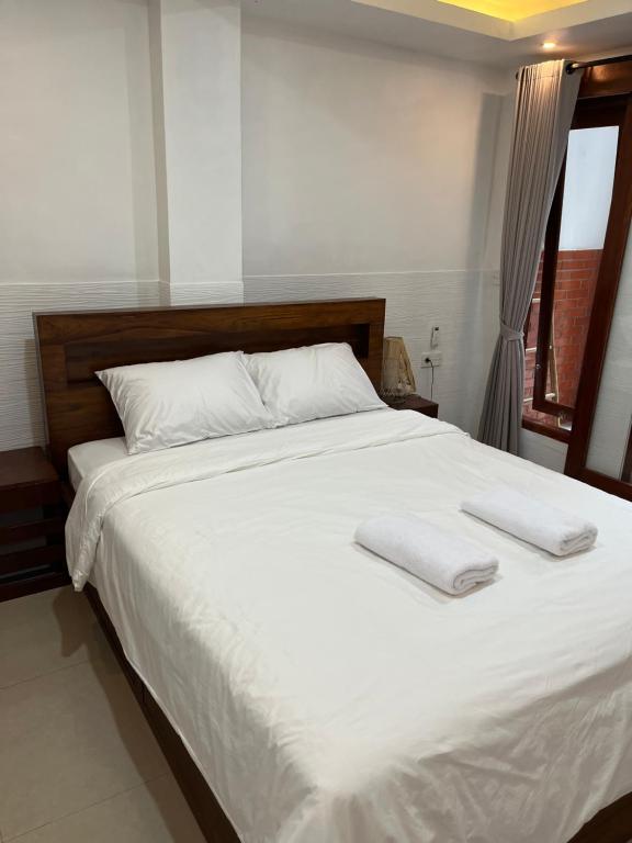 Postel nebo postele na pokoji v ubytování Gusti Room II