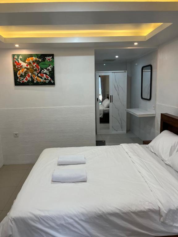 Postel nebo postele na pokoji v ubytování Gusti Room II
