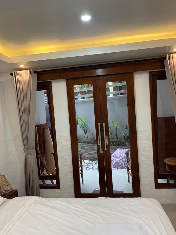 Postel nebo postele na pokoji v ubytování Gusti Room II