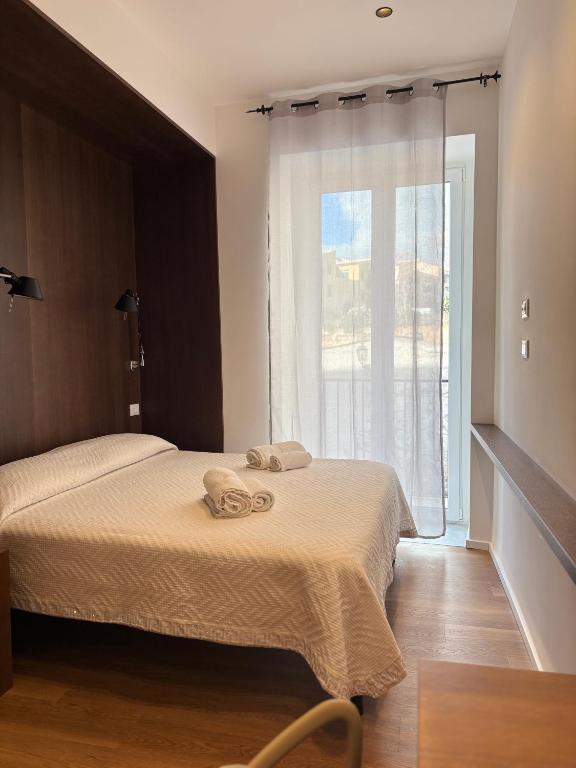 Postel nebo postele na pokoji v ubytování B&B Sulle Vie del Capo