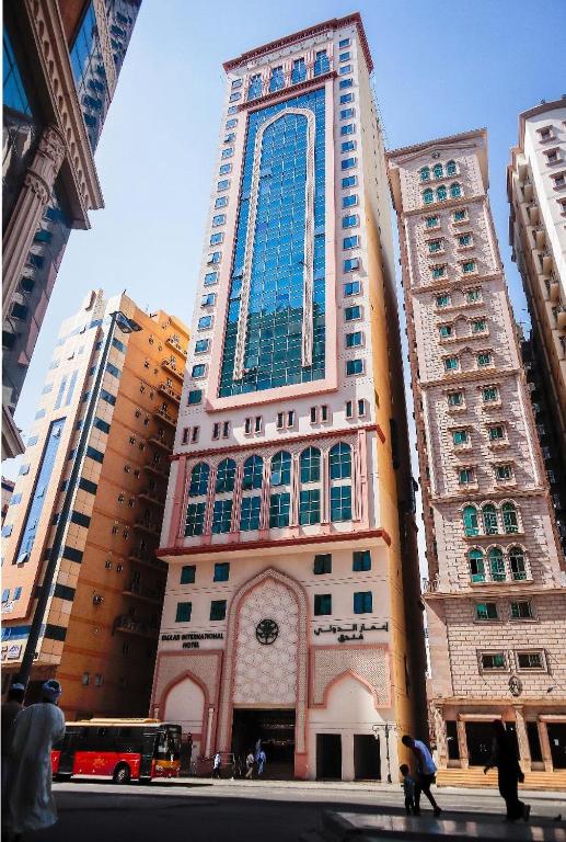 a tall building with a window on the side of it at Emaar International in Mecca