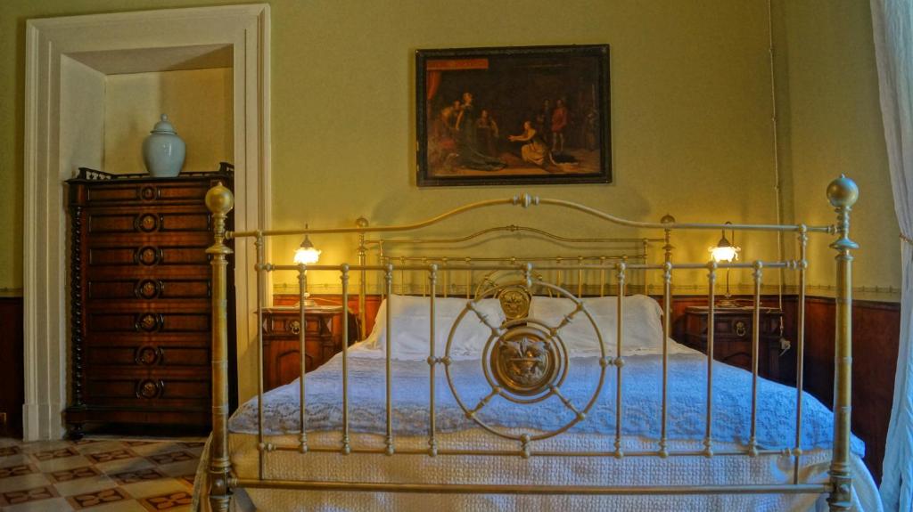 Postel nebo postele na pokoji v ubytování Historical Suites VVM
