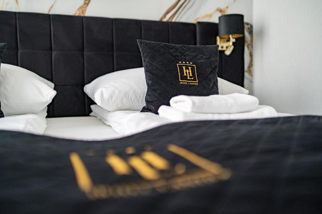 Posteľ alebo postele v izbe v ubytovaní Hotel Lantier Wellness & Spa