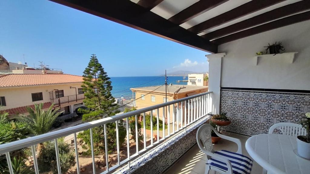 a balcony with a view of the ocean at Apartamento Playa La Calica in San Juan de los Terreros