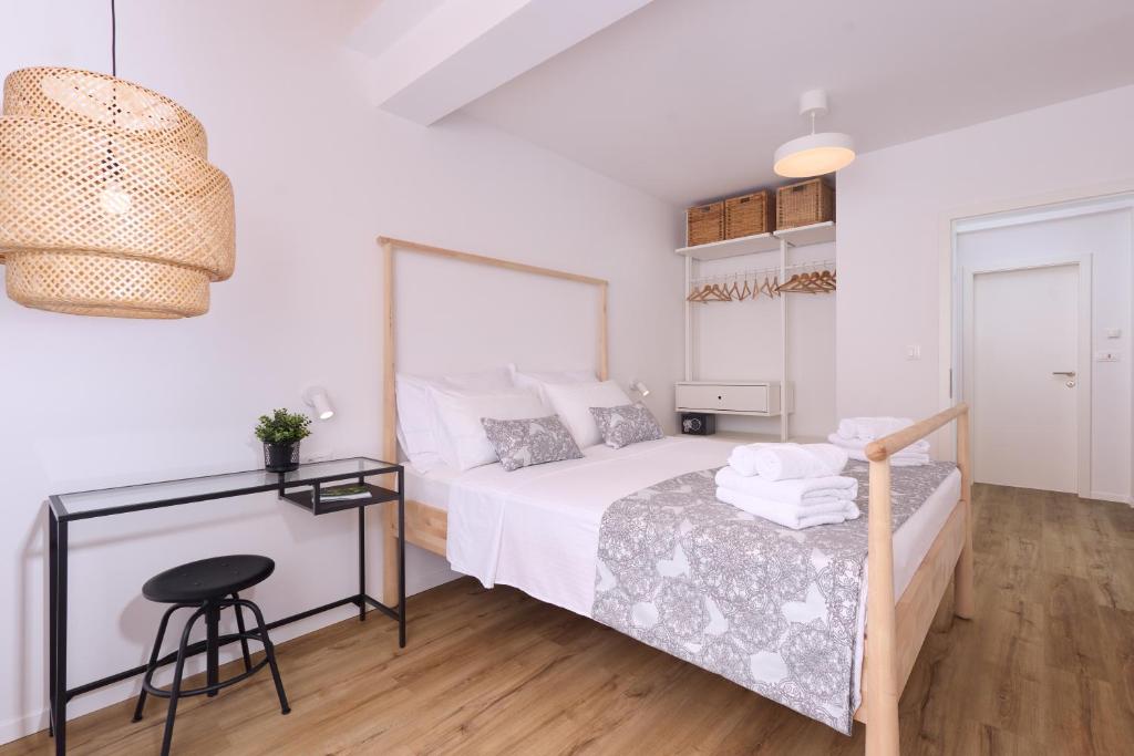 Postel nebo postele na pokoji v ubytování Plitvice Nest Apartments