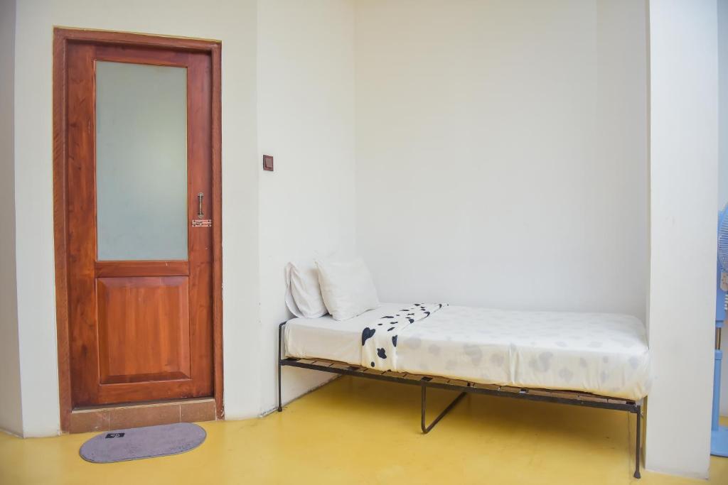 Postel nebo postele na pokoji v ubytování The Residence Ella