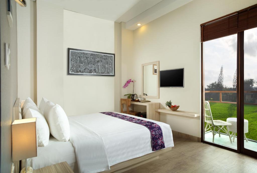 TV a/nebo společenská místnost v ubytování The Evitel Resort Ubud