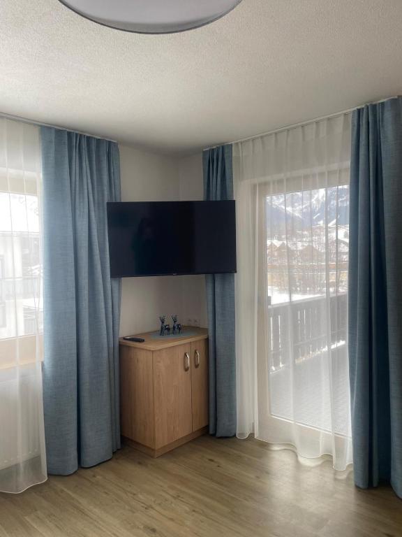 TV a/nebo společenská místnost v ubytování Haus Lusspark