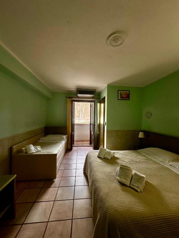 Postel nebo postele na pokoji v ubytování Hotel C0C00N Garden