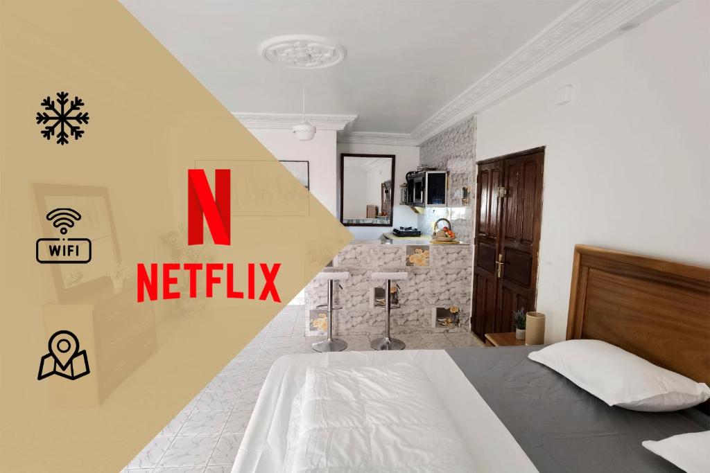 Ένα ή περισσότερα κρεβάτια σε δωμάτιο στο "Le BAOBAB" - CALME - CLIM - WIFI - White Butterfly Hotels