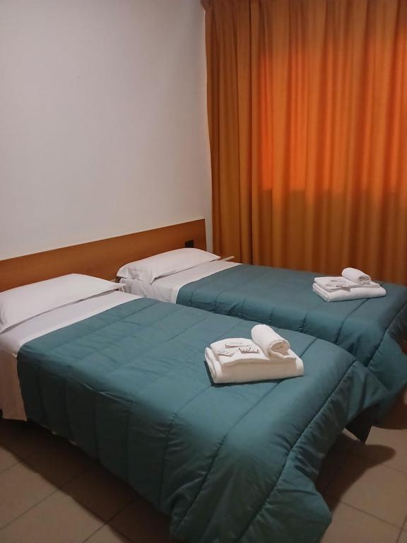 Postel nebo postele na pokoji v ubytování Hotel Ponsacco HP