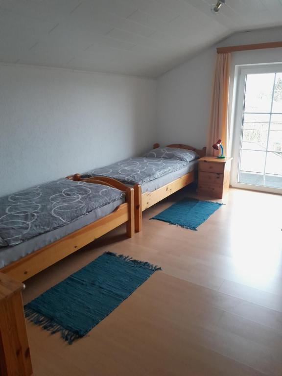 Postel nebo postele na pokoji v ubytování Ferienwohnung Moorblick