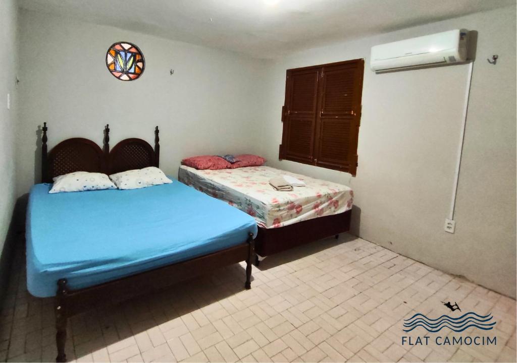 Letto o letti in una camera di Casa grande no centro em Camocim CE