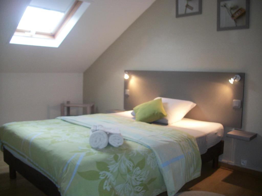Postel nebo postele na pokoji v ubytování Le Rubinjo - Appartement d'hôtes