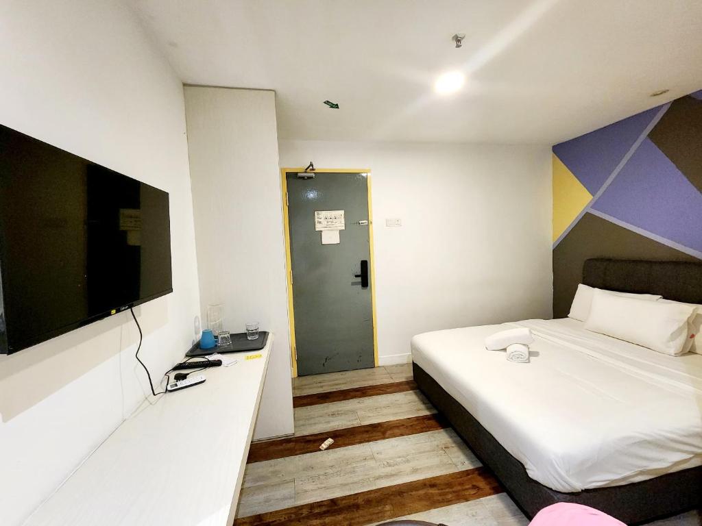 Postel nebo postele na pokoji v ubytování 5min to Genting Outlet Gohtong Jaya Hotel