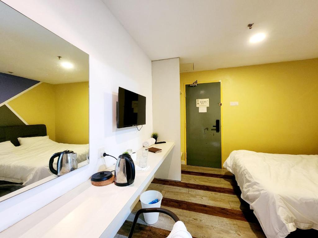 Postel nebo postele na pokoji v ubytování 5min to Genting Outlet Gohtong Jaya Hotel