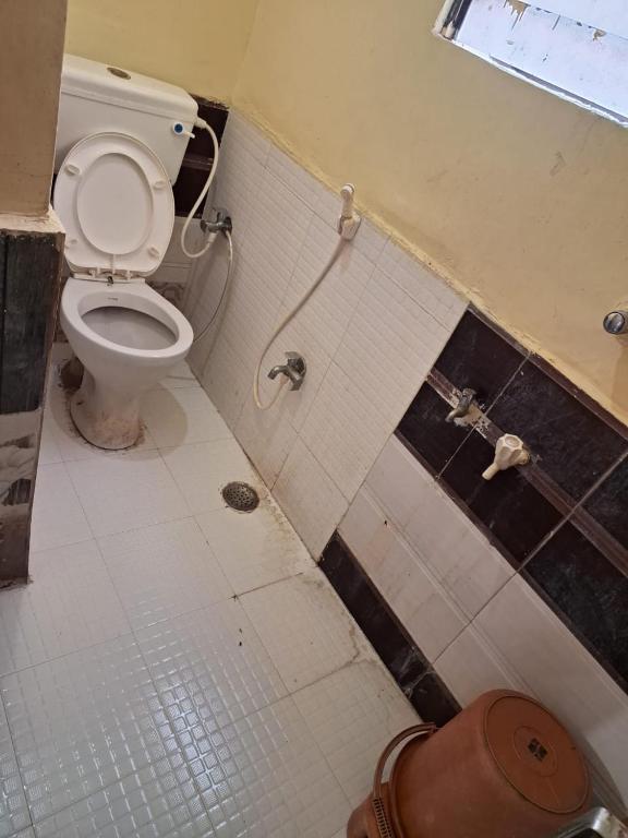 Koupelna v ubytování Hotel Sai Satya