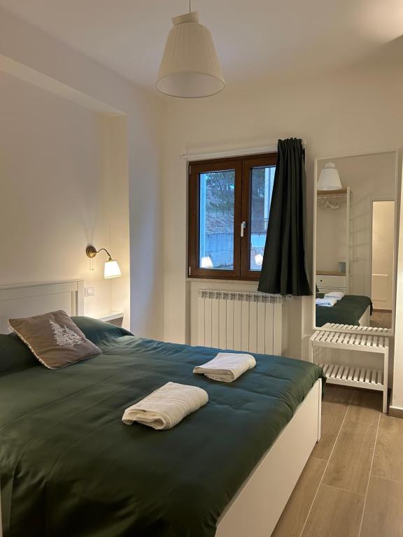 Ένα ή περισσότερα κρεβάτια σε δωμάτιο στο AnGiem house Rivisondoli