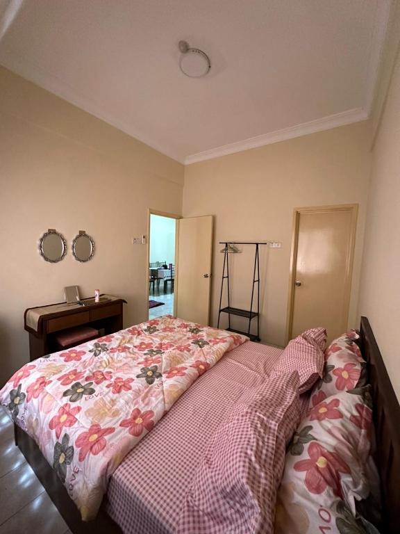 Ένα ή περισσότερα κρεβάτια σε δωμάτιο στο DHW Homestay