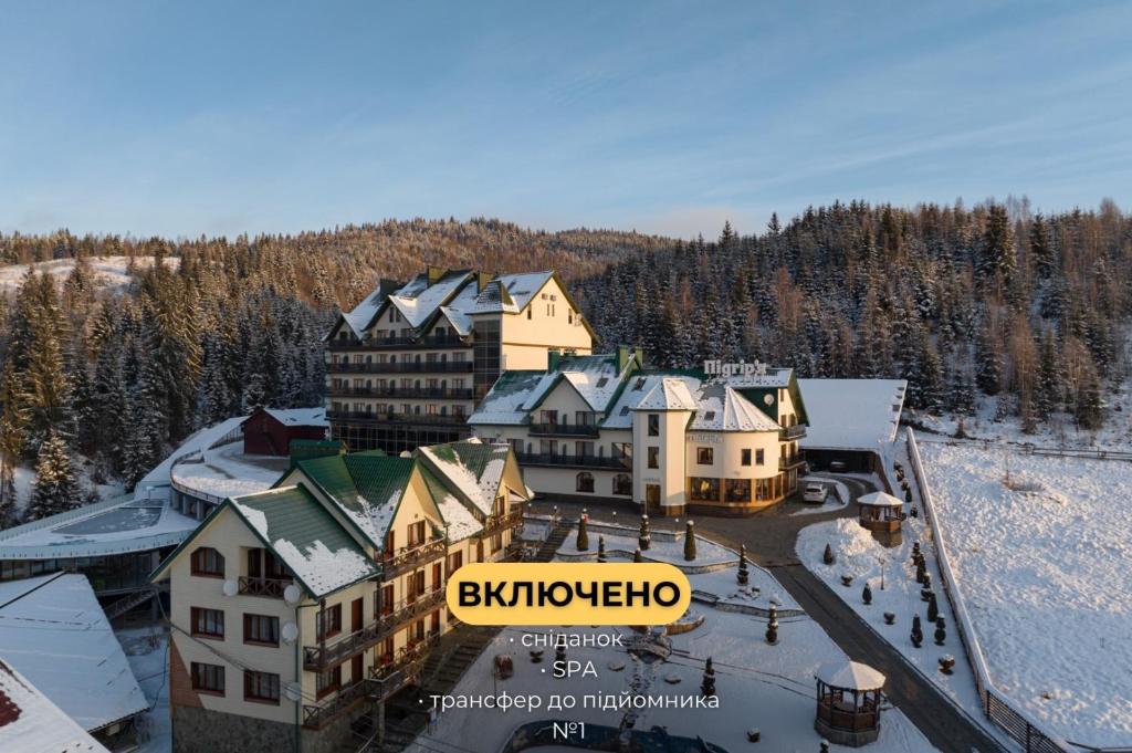 an aerial view of a resort in the snow at Hotel Podgorie Spa in Bukovel