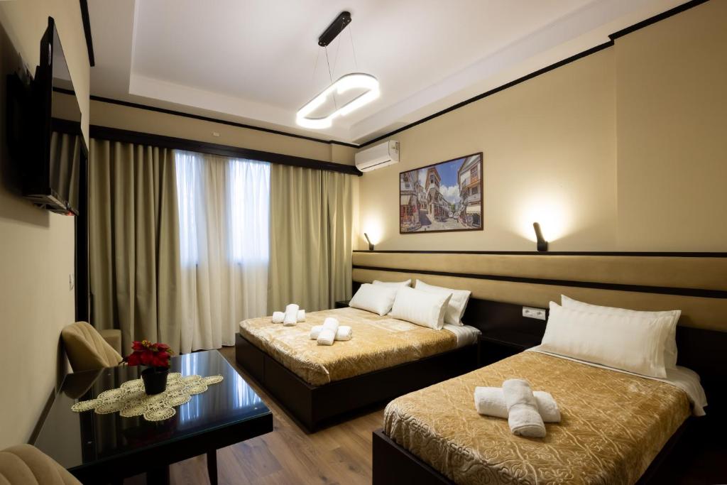Postel nebo postele na pokoji v ubytování Guest House Shtaka