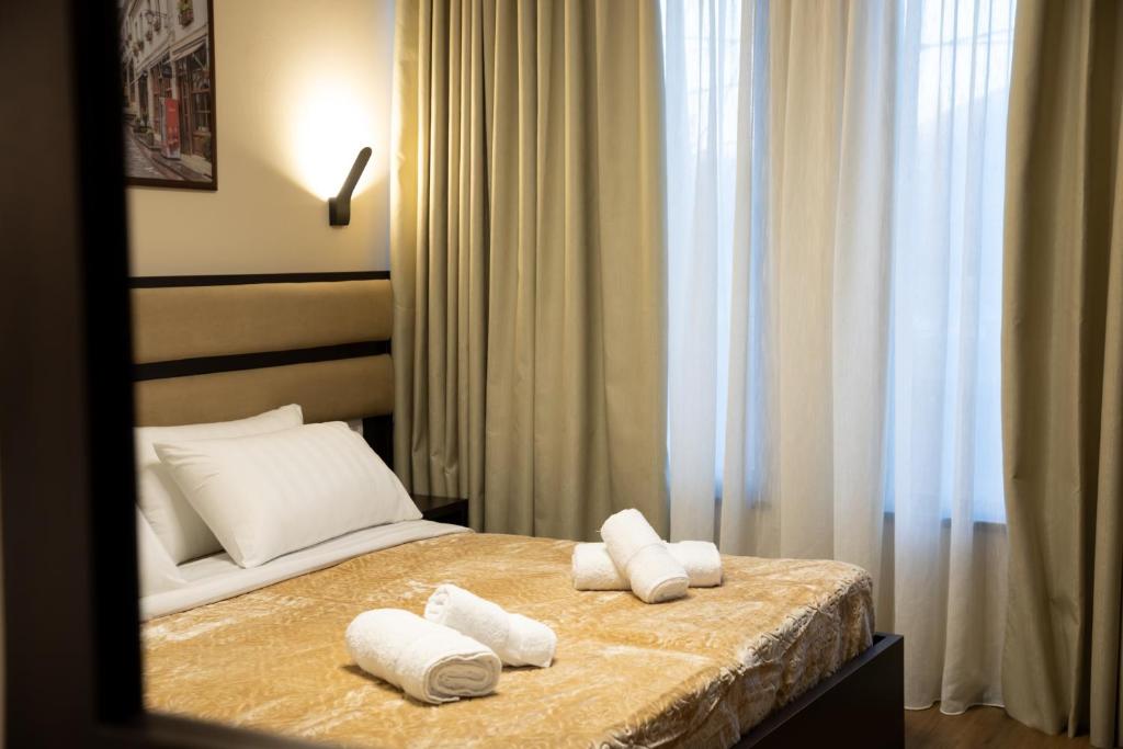 Postel nebo postele na pokoji v ubytování Guest House Shtaka