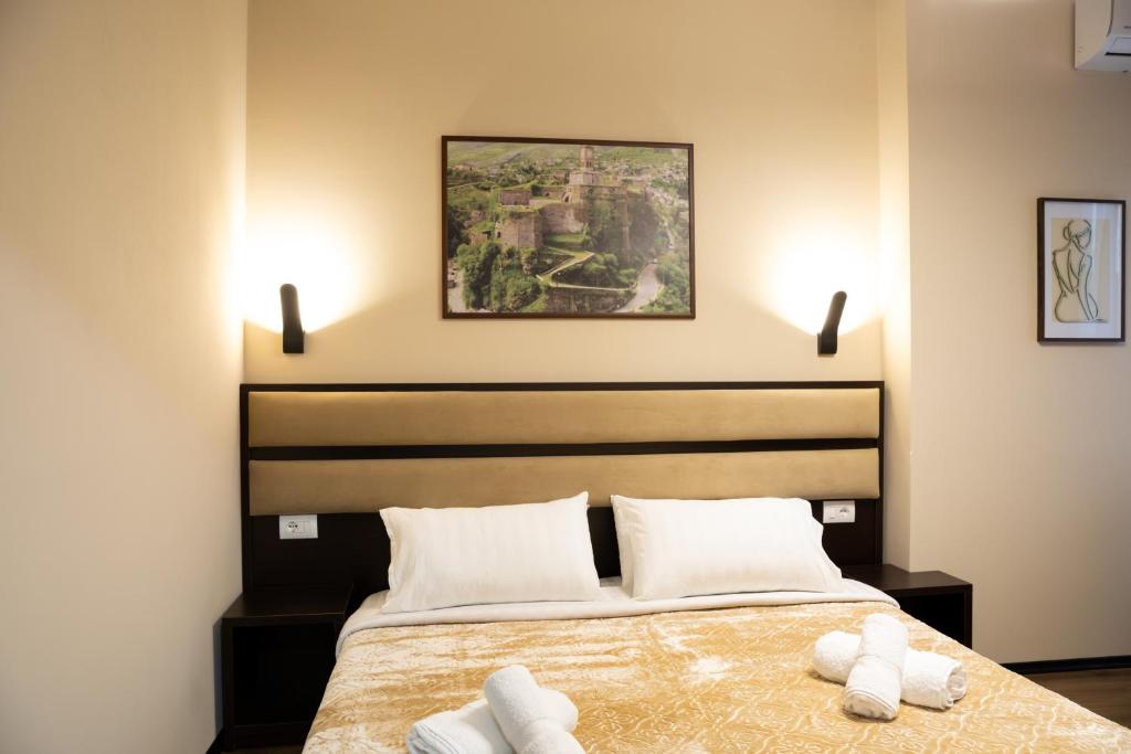 Postel nebo postele na pokoji v ubytování Guest House Shtaka