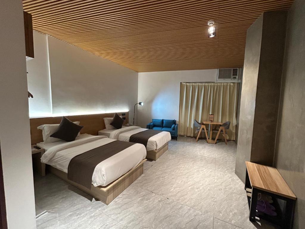 Postel nebo postele na pokoji v ubytování Terra Hotel Kawit