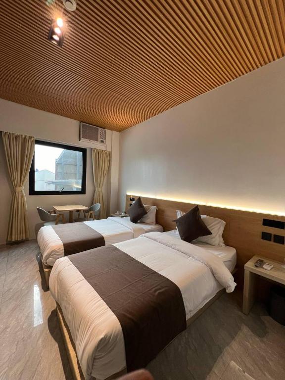 Postel nebo postele na pokoji v ubytování Terra Hotel Kawit