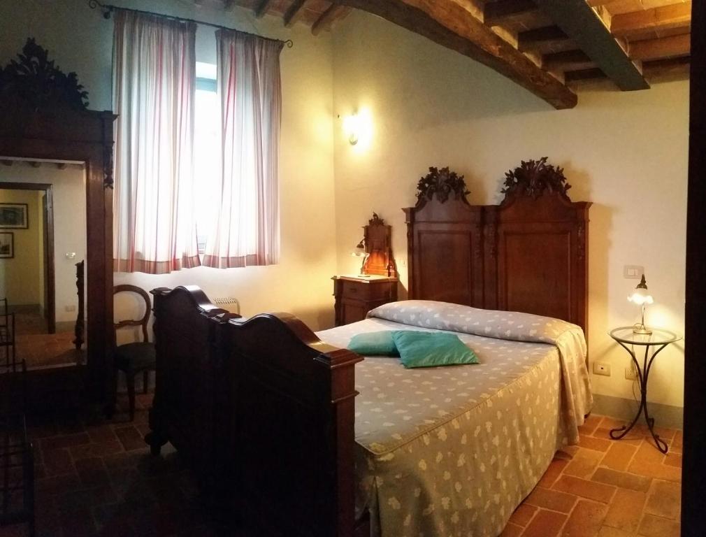 Postel nebo postele na pokoji v ubytování Agriturismo Podere Alberese