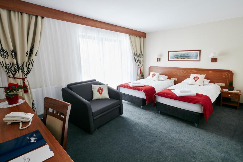 Postel nebo postele na pokoji v ubytování Hotel Logos