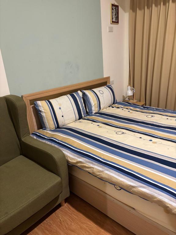 Postel nebo postele na pokoji v ubytování 果芒驛站旅店