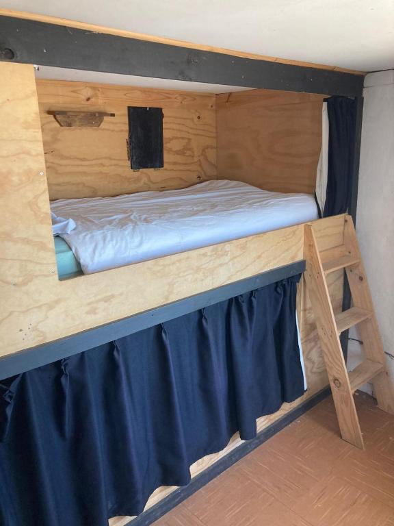 Uma cama ou camas num quarto em El Barco Pichilemu