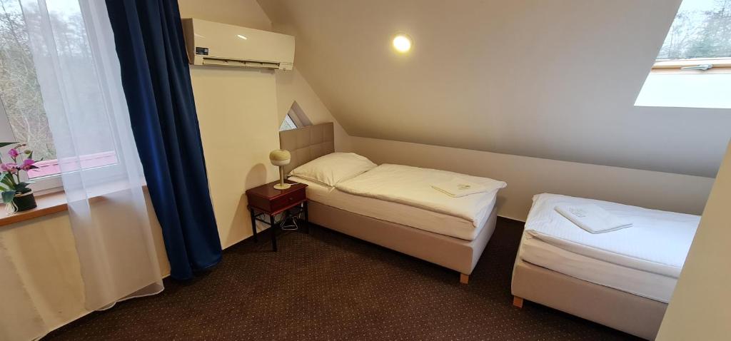 Postel nebo postele na pokoji v ubytování Apartmány Orlová