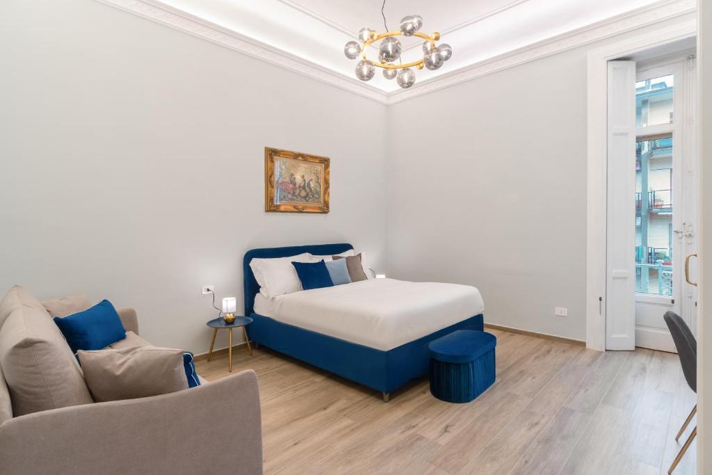 Ένα ή περισσότερα κρεβάτια σε δωμάτιο στο Palazzo Galeoni Luxury Suites