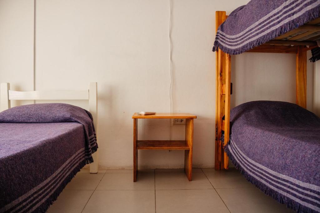 Postel nebo postele na pokoji v ubytování SIGRUM Hostel