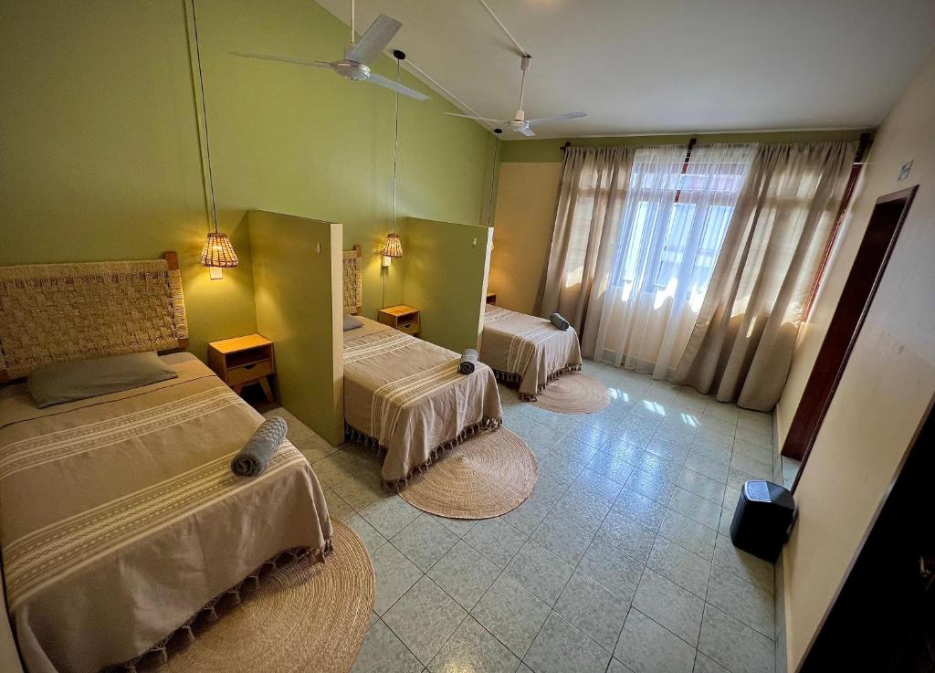 Letto o letti in una camera di Hostal Central Oaxaca