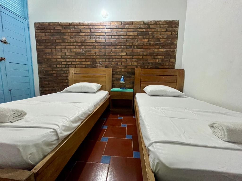 Postel nebo postele na pokoji v ubytování Sana Mar Hostel & Eco-Café
