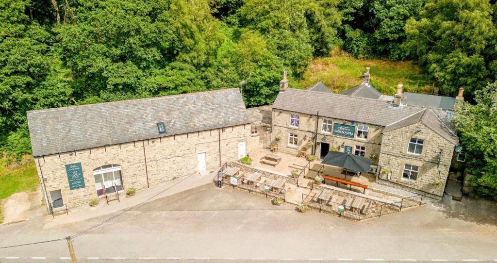 an aerial view of a large stone house at The Ladybower Inn in Bamford