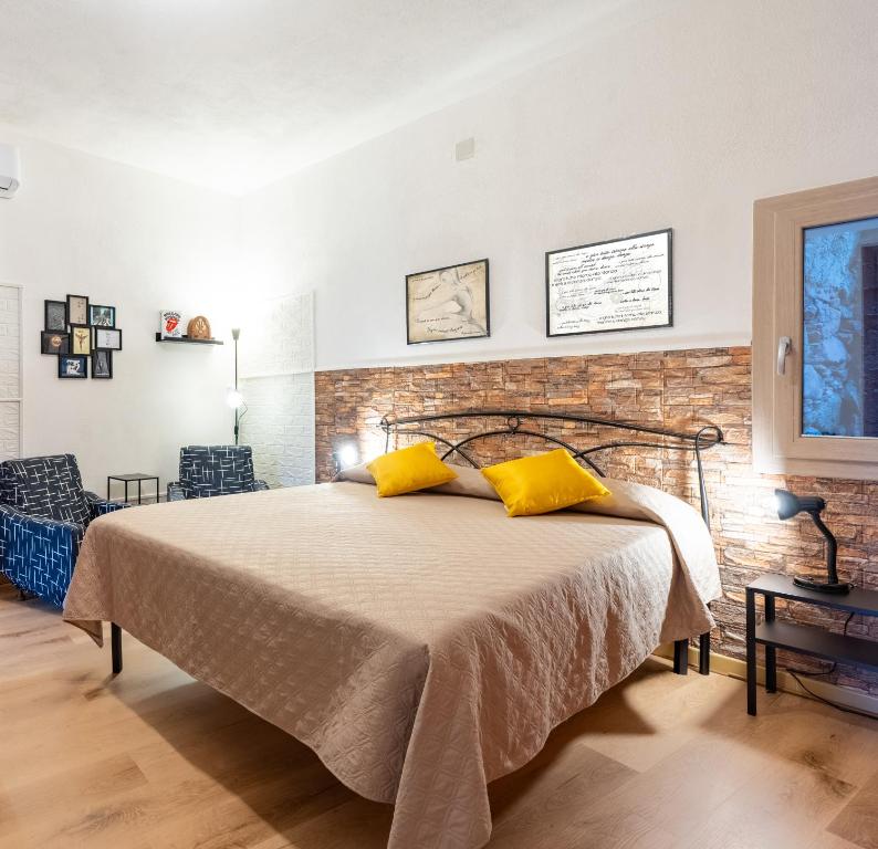 Ένα ή περισσότερα κρεβάτια σε δωμάτιο στο Il Cinghiale Bianco