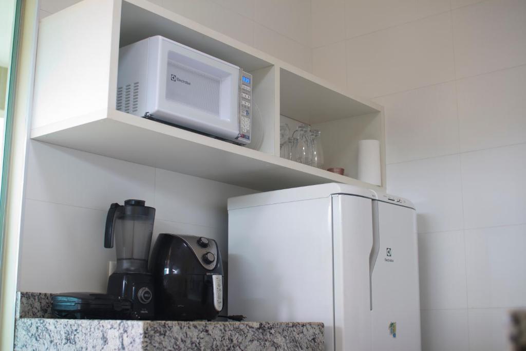 Kuchyň nebo kuchyňský kout v ubytování Suítes Conforto no Paraíso