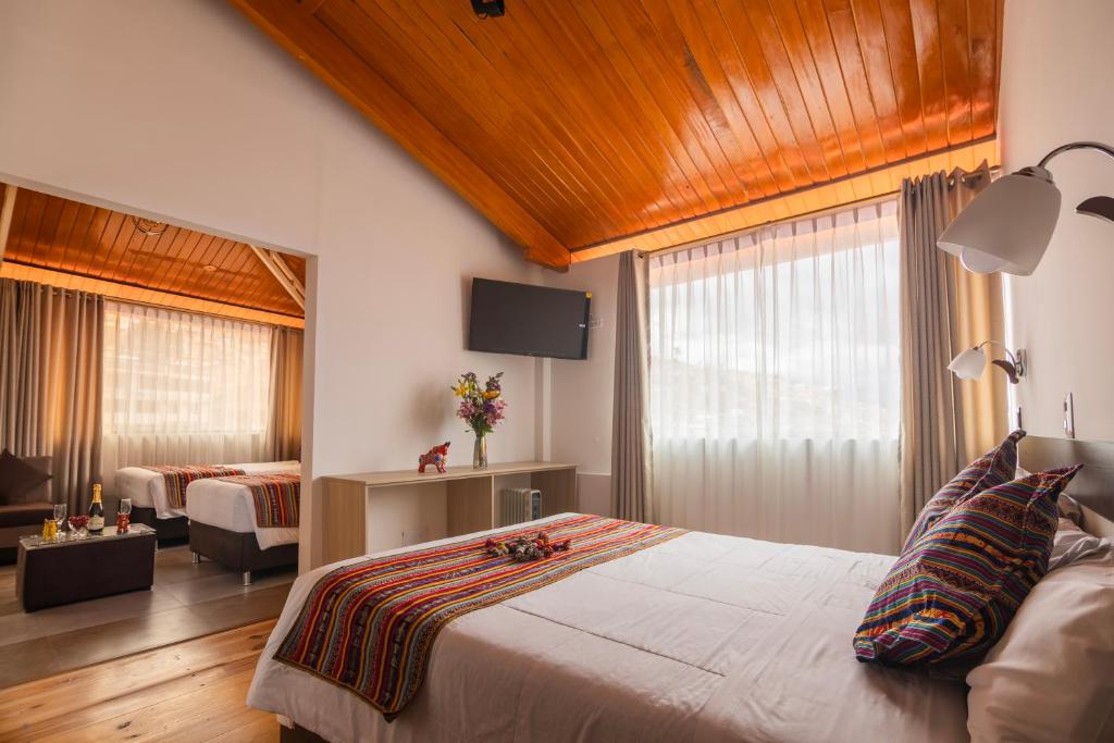 Postel nebo postele na pokoji v ubytování Hotel Kapac Inn-San Blas