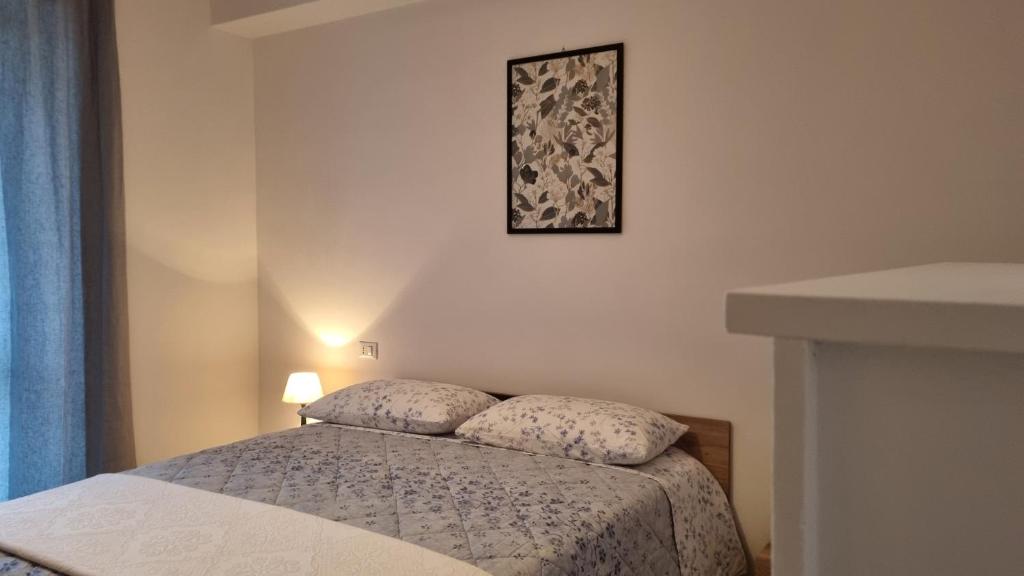 Postel nebo postele na pokoji v ubytování La Piccola Dimora Nel Borgo