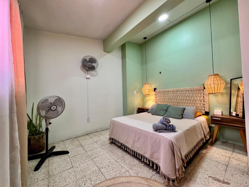 Letto o letti in una camera di Hostal Central Oaxaca