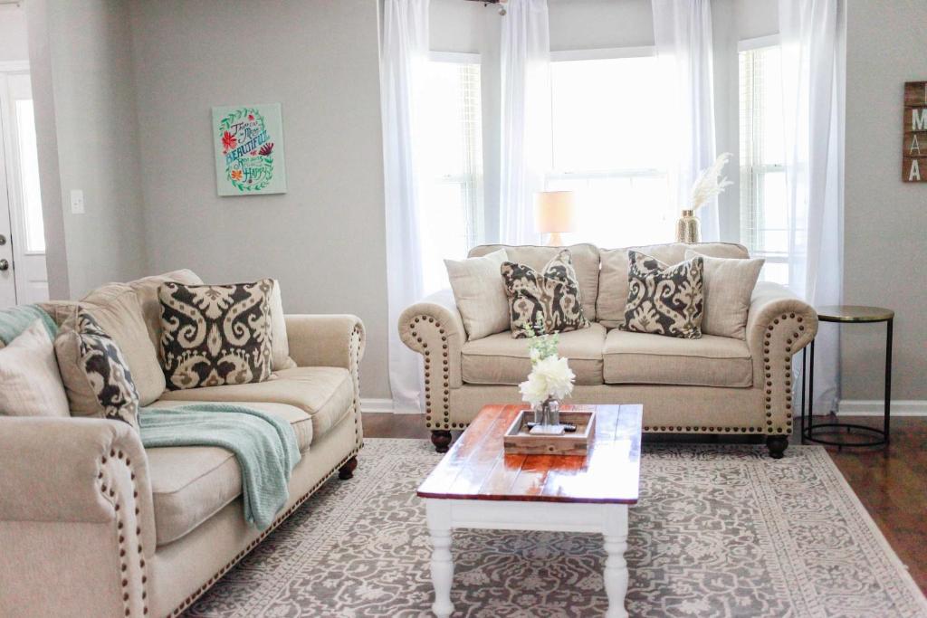 a living room with two couches and a coffee table at Sojourn Family Home Sleeps 6 in Norfolk